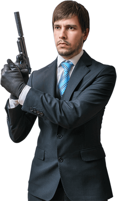 Man in suit wearing gloves holding silenced handgun